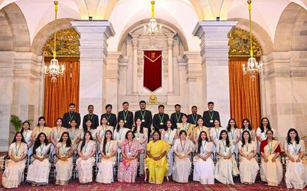 President Droupadi Murmu poses for a group photograph with officers of the CPES and IES at Rashtrapati Bhavan. Pic/PTI